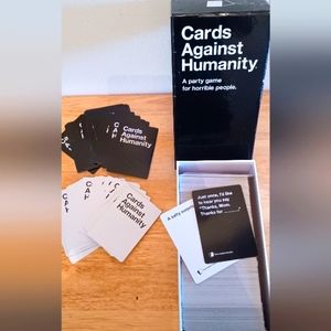 Cards against Humanity, a party game for horrible people. (Pre-owned).